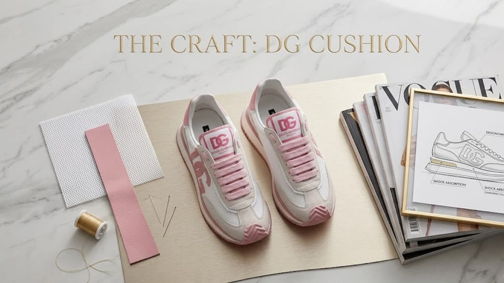 DG sneaker styling guide showcasing pink Dolce & Gabbana cushion sneakers with logo detail on a marble platform